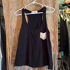 Black tank top with white pocket. Size small